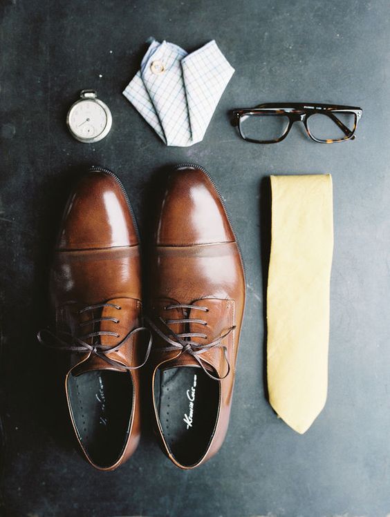 Groom attire, yellow tie and brown leather shoes for an elegant wedding