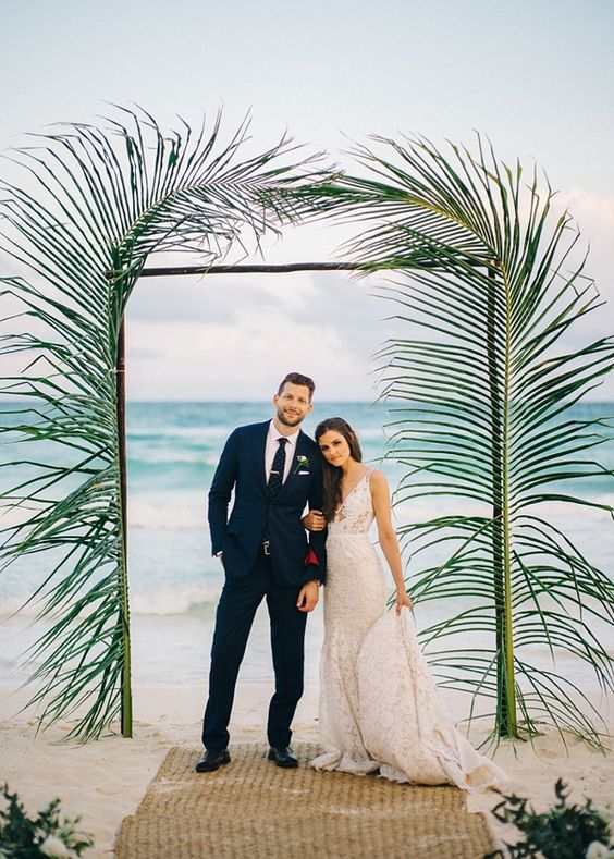 Simple modern palm leaves for beach wedding ceremony arch.  | Wedding | Beach Wedding | Beach Wedding Ideas | Bride | Groom | Wedding Photography | #weddings #beach #beachwedding #weddinginspiration #weddingphotography | www.laurenlashdesigns.com