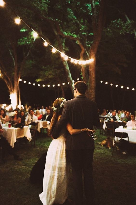 Fairy lights add charming ambiance to this backyard wedding | Lauren Apel Photo